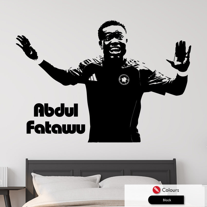 Wall decal of a leicester city footballer Abdul Fatawu with arms outstretched on a bedroom wall.