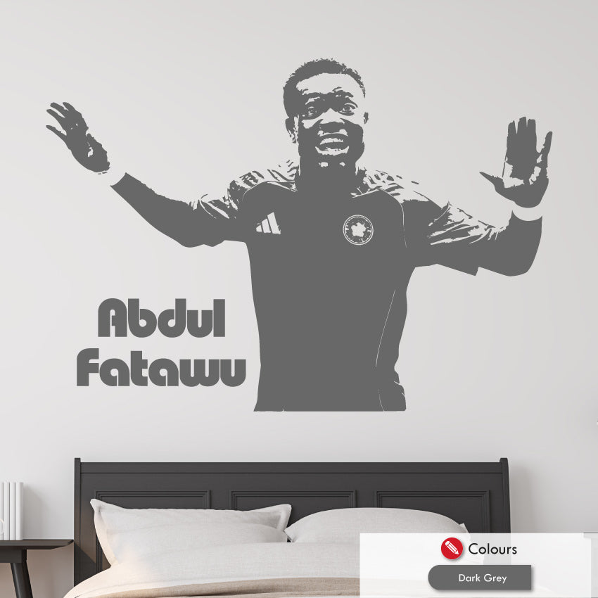Wall decal of a leicester city footballer Abdul Fatawu with arms outstretched on a bedroom wall.