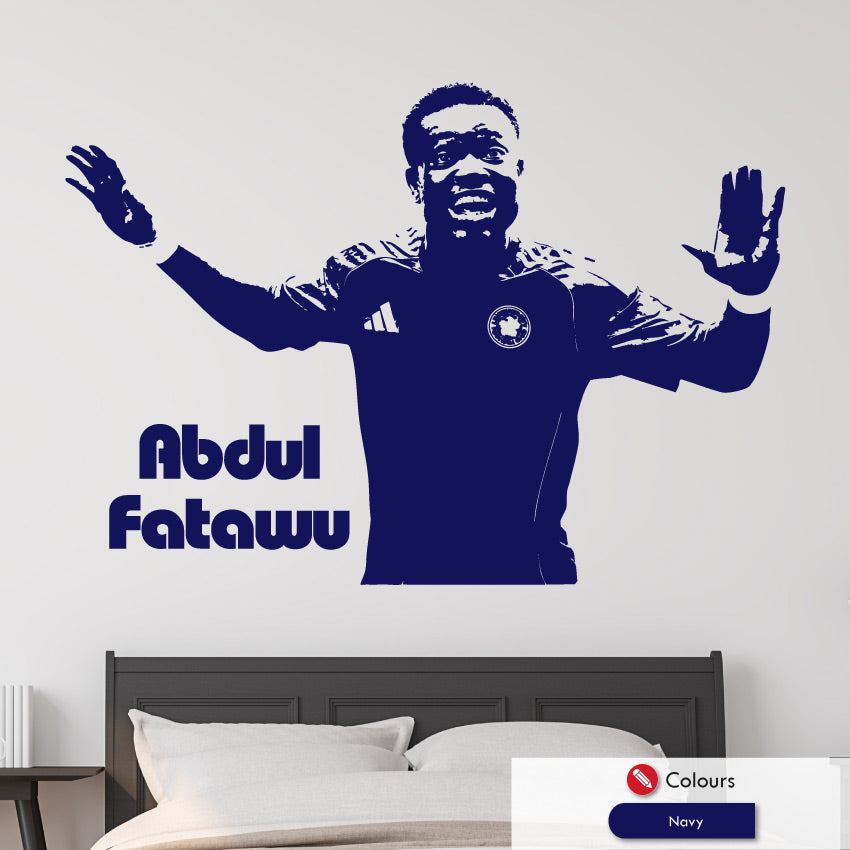 Wall decal of a leicester city footballer Abdul Fatawu with arms outstretched on a bedroom wall.
