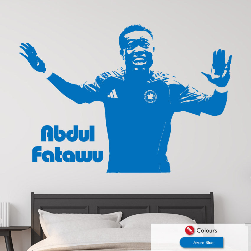 Wall decal of a leicester city footballer Abdul Fatawu with arms outstretched on a bedroom wall.